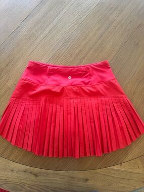 Baleaf Red Pleated Athletic Mini Skirt with Zip Pocket
